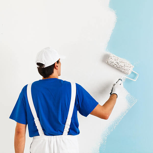 man painting wall